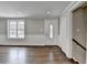 Living area with hardwood floors, large windows, and classic trim at 5155 Rosestone Nw Dr, Lilburn, GA 30047