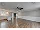 Open-concept living space with hardwood floors seamlessly connected to the adjacent kitchen at 5155 Rosestone Nw Dr, Lilburn, GA 30047