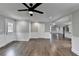 Spacious living room with hardwood floors, white trim, and access to multiple rooms at 5155 Rosestone Nw Dr, Lilburn, GA 30047