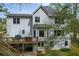Two-story home featuring a large deck, gray siding, and multiple windows offering ample natural light at 819 Holly Rdg, Canton, GA 30115
