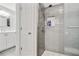 Modern bathroom with tiled shower, glass door, and stylish vanity at 819 Holly Rdg, Canton, GA 30115