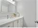 Bright bathroom featuring a white vanity with a quartz countertop and a large mirror at 819 Holly Rdg, Canton, GA 30115