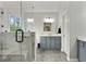 Bathroom featuring a glass shower, vanity with drawers, and modern fixtures at 819 Holly Rdg, Canton, GA 30115