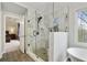 Modern bathroom with glass shower, soaking tub, and marble tile at 819 Holly Rdg, Canton, GA 30115