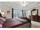 Large bedroom with tray ceiling, large windows, and neutral carpeting at 819 Holly Rdg, Canton, GA 30115