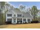 Traditional two-story home with a manicured lawn, charming front porch, and classic architectural details at 819 Holly Rdg, Canton, GA 30115