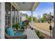 Inviting front porch with rocking chairs, decorative plants and manicured front yard at 819 Holly Rdg, Canton, GA 30115