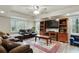Basement living room with comfortable furniture, TV, and natural light at 819 Holly Rdg, Canton, GA 30115
