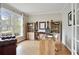 Bright home office with hardwood floors, large windows, built-in bookshelves, and a comfortable workspace at 819 Holly Rdg, Canton, GA 30115