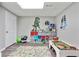 Basement playroom with toy storage and colorful rug at 819 Holly Rdg, Canton, GA 30115