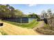Community tennis courts and cabana surrounded by lush greenery in a well-maintained neighborhood at 819 Holly Rdg, Canton, GA 30115