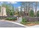 Community area with fenced yard, outdoor fireplace and manicured landscaping at 4460 Dalston Ne Dr, Atlanta, GA 30342