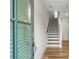Bright entryway showcasing hardwood floors, staircase with modern railings, and plenty of natural light at 4460 Dalston Ne Dr, Atlanta, GA 30342