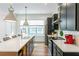 Spacious kitchen featuring a large island with a breakfast bar, stainless appliances, and modern cabinetry at 4460 Dalston Ne Dr, Atlanta, GA 30342