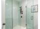 Glass shower with rainfall shower head and decorative plants at 4460 Dalston Ne Dr, Atlanta, GA 30342