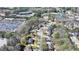 An aerial view showing the home within a community with trees, parking, and pond at 5190 Deerlake Dr, Alpharetta, GA 30005