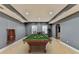 Finished basement with a pool table, recessed lights and adjacent seating at 5190 Deerlake Dr, Alpharetta, GA 30005