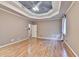 Spacious primary bedroom with hardwood flooring, trey ceiling, and natural light at 5190 Deerlake Dr, Alpharetta, GA 30005