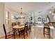 Open-concept dining area connects to living spaces, enhancing flow and natural light at 5190 Deerlake Dr, Alpharetta, GA 30005