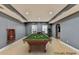 Spacious game room with pool table, neutral walls, recessed lighting, and hardwood flooring at 5190 Deerlake Dr, Alpharetta, GA 30005