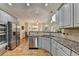 Kitchen with granite countertops, stainless steel appliances, and adjacent dining area at 5190 Deerlake Dr, Alpharetta, GA 30005