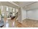 Spacious living room with fireplace, large windows, hardwood floors, and staircase at 5190 Deerlake Dr, Alpharetta, GA 30005