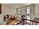 Second story view of the living room with a fireplace, large windows, and hardwood floors at 5190 Deerlake Dr, Alpharetta, GA 30005