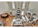 Overhead view of the living room featuring a fireplace, built-in shelving, and dining area at 5190 Deerlake Dr, Alpharetta, GA 30005