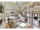 Light and airy living room featuring a fireplace, high ceilings, and hardwood flooring at 5190 Deerlake Dr, Alpharetta, GA 30005