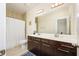 Well-lit bathroom with double sink vanity, shower, and bath area at 1096 Holly Ave, Atlanta, GA 30338