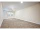 Spacious carpeted bedroom with natural light from window, freshly painted at 1096 Holly Ave, Atlanta, GA 30338