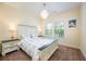 Cozy bedroom with carpet, a comfortable bed, and soft lighting at 1096 Holly Ave, Atlanta, GA 30338