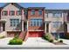 Charming townhome with red brick facade, garage, and well-maintained landscaping at 1096 Holly Ave, Atlanta, GA 30338