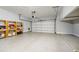 Well-lit two-car garage featuring epoxy flooring and ample storage shelves at 1096 Holly Ave, Atlanta, GA 30338
