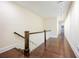 Hallway with dark hardwood floors and white railing at 1096 Holly Ave, Atlanta, GA 30338