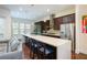 Modern kitchen featuring a large quartz island, stainless steel appliances, and dark wood cabinets at 1096 Holly Ave, Atlanta, GA 30338