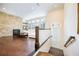 Bright living room featuring hardwood floors, stone fireplace, and a cozy seating area at 1096 Holly Ave, Atlanta, GA 30338