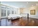 Spacious living room with hardwood flooring, large windows, and a comfortable white sofa at 1096 Holly Ave, Atlanta, GA 30338
