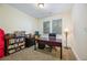 Inviting home office with desk, bookshelf, carpet and natural light at 1096 Holly Ave, Atlanta, GA 30338