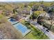 Aerial view showing tennis courts and mature trees at 1355 Euclid Ne Ave # 21B, Atlanta, GA 30307