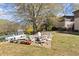 Enjoy the outdoors with this relaxing backyard area that features a large lawn and a variety of patio furniture at 1355 Euclid Ne Ave # 21B, Atlanta, GA 30307