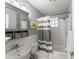 Bright bathroom features a shower-tub combination with white tile surround, sink with storage, and modern fixtures at 1355 Euclid Ne Ave # 21B, Atlanta, GA 30307