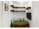 Intimate bedroom space featuring custom shelving and storage at 1355 Euclid Ne Ave # 21B, Atlanta, GA 30307