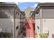 Exterior view shows red staircases that lead to the second level apartments at 1355 Euclid Ne Ave # 21B, Atlanta, GA 30307