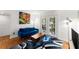 Bright living room featuring a blue sofa, hardwood floors, and french doors to the outside at 1355 Euclid Ne Ave # 21B, Atlanta, GA 30307