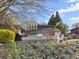 Community signage is surrounded by mature trees and lush landscaping at 1355 Euclid Ne Ave # 21B, Atlanta, GA 30307