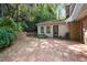 Brick patio surrounded by beautiful greenery, creating a relaxing outdoor living space at 3474 Castleridge Dr, Tucker, GA 30084