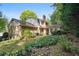 Lovely backyard featuring lush foliage, a brick exterior, and a cozy spot for outdoor relaxation at 3474 Castleridge Dr, Tucker, GA 30084