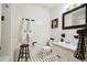 Stylish bathroom with black and white patterned floors, tiled walls, and a sleek black mirror at 3474 Castleridge Dr, Tucker, GA 30084