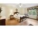 Inviting bedroom featuring wood floors, classic decor, and natural light at 3474 Castleridge Dr, Tucker, GA 30084